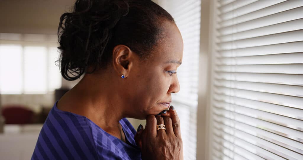 woman at window needing OCD therapist