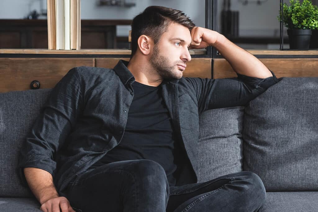 man on couch getting anxiety treatment