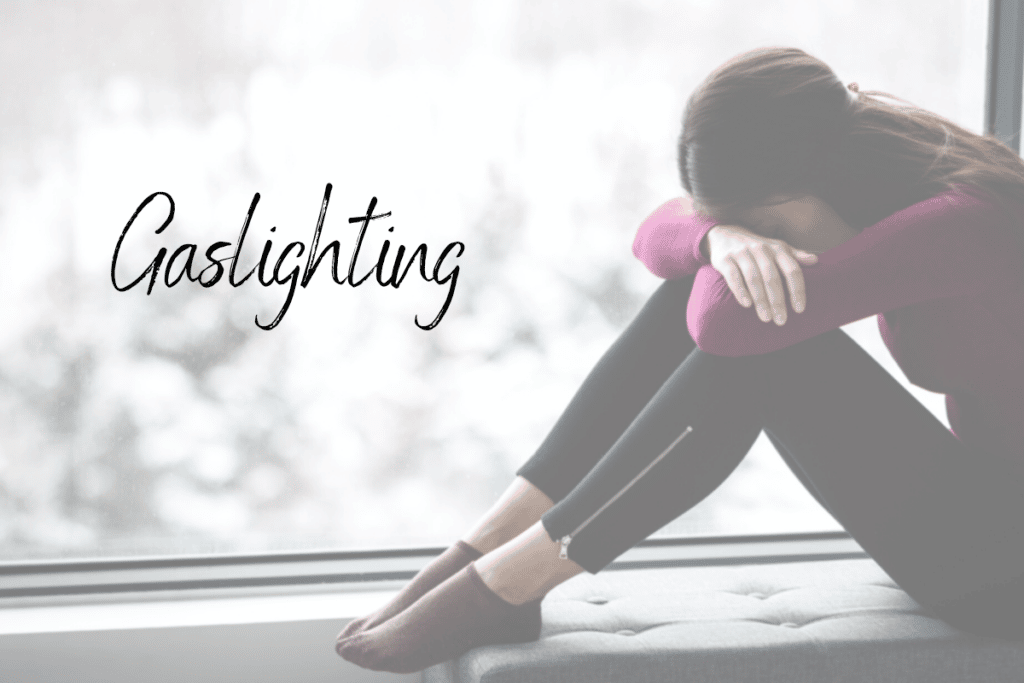 woman sitting on couch leaning on her two knees