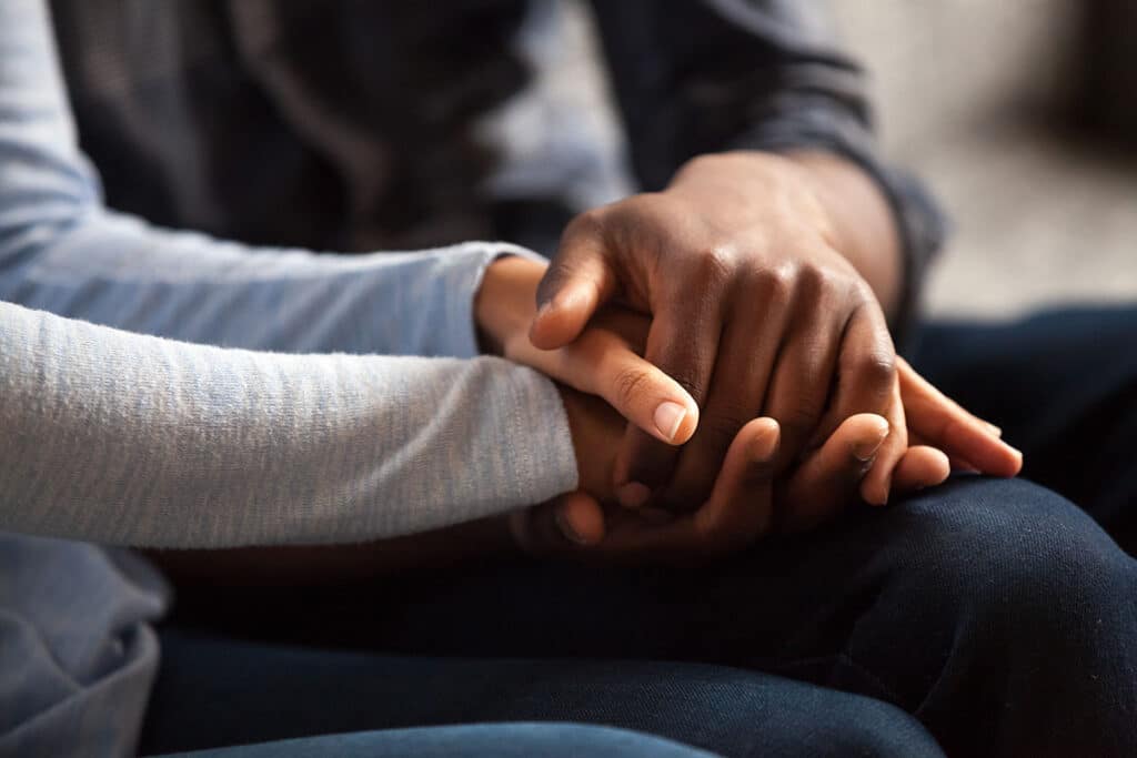 couple holding hands needing bipolar disorder therapist