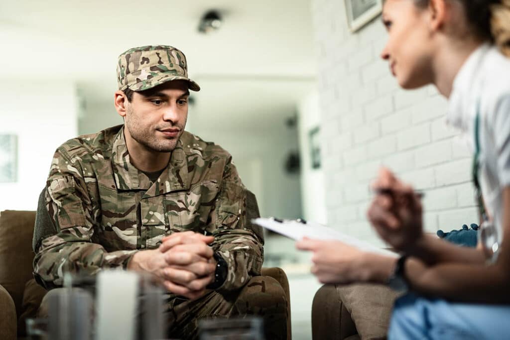 soldier talking to therapist showing veterans and mental health