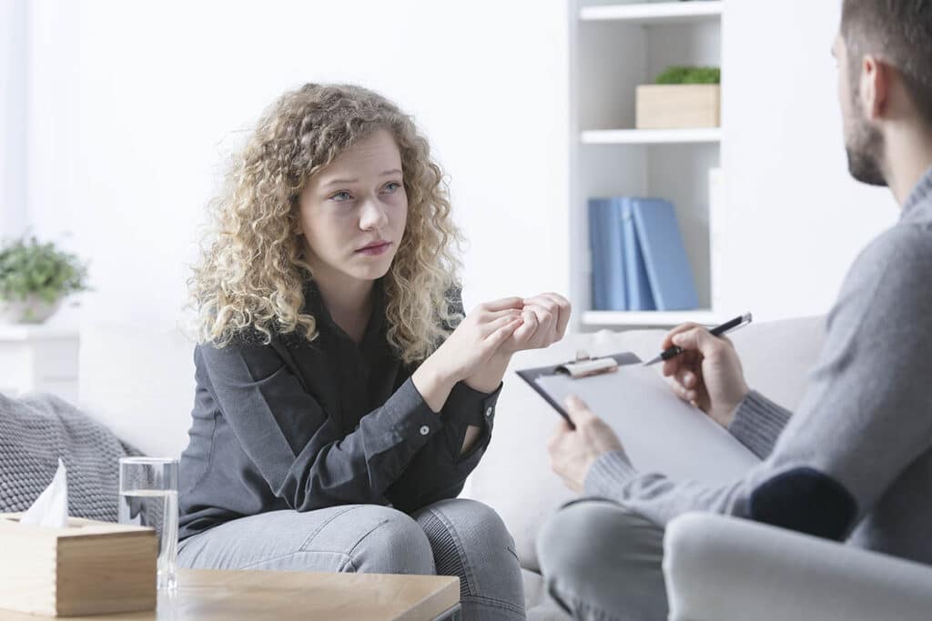 young woman meeting with OCD therapist near berlin nj