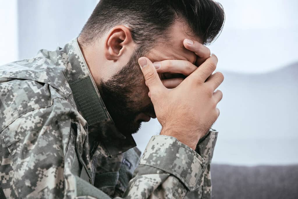 soldier covering his face needing a PTSD therapist near Berlin NJ