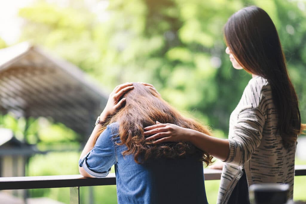 individual comforting another dealing with anxiety in relationships