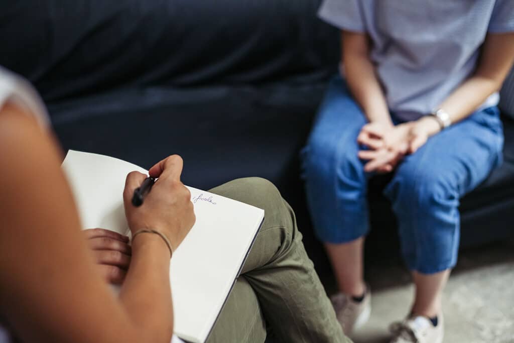 anxiety therapist near Berlin NJ taking notes during session