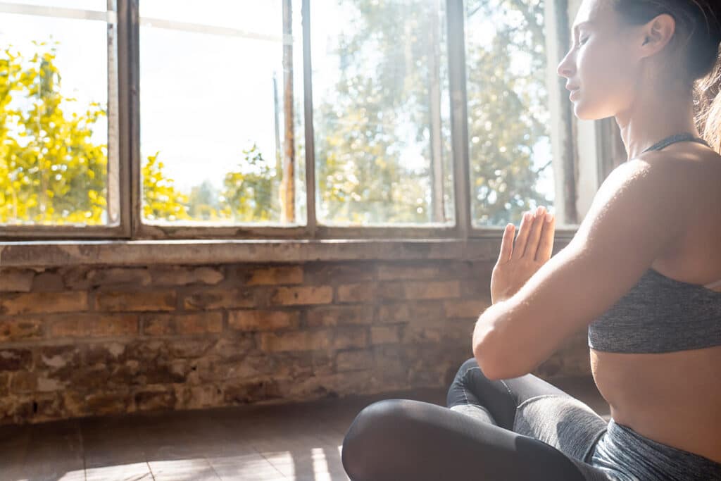 woman doing yoga to calm the mind