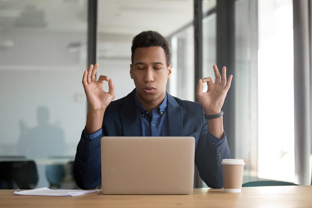 a man meditates as one of the common techniques to reduce stress