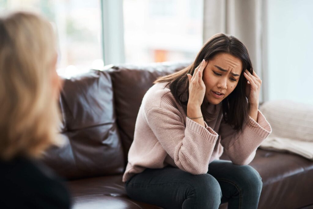 young woman having a therapeutic session with a psychologist