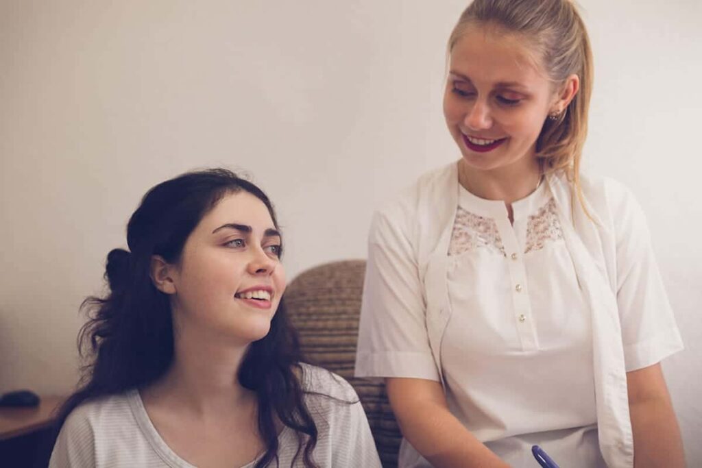 women talking about yoga therapy