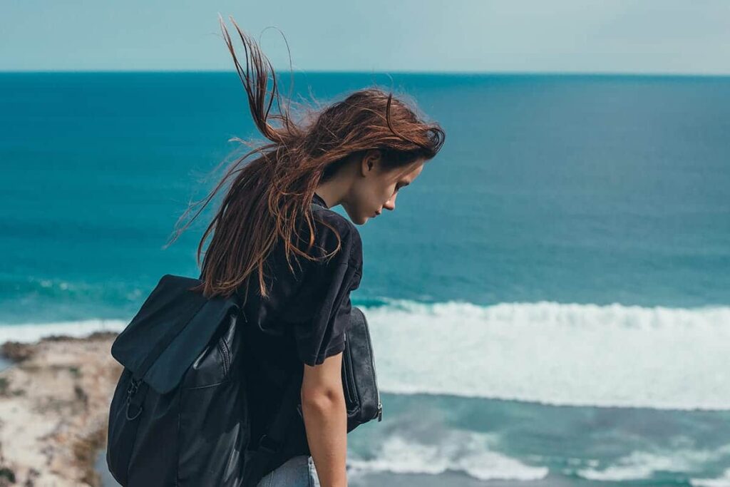 woman by the beach wonders what is holistic therapy?
