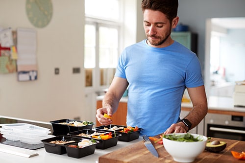 man cooking understanding the connection between nutrition and diet