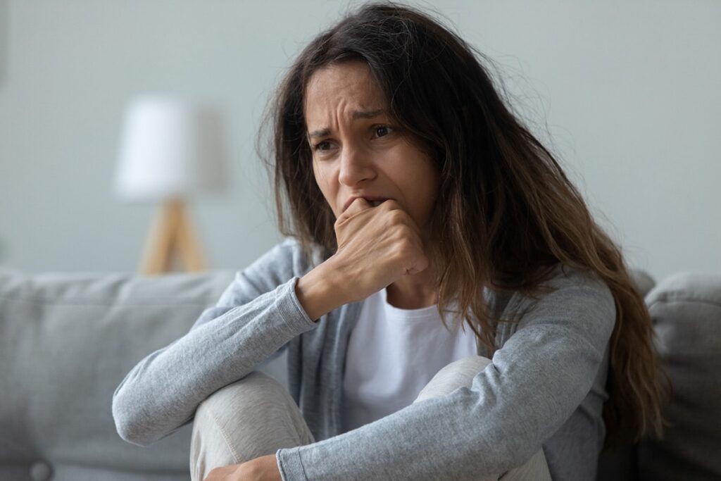 A woman begins to cry as she exhibits the signs of anxiety