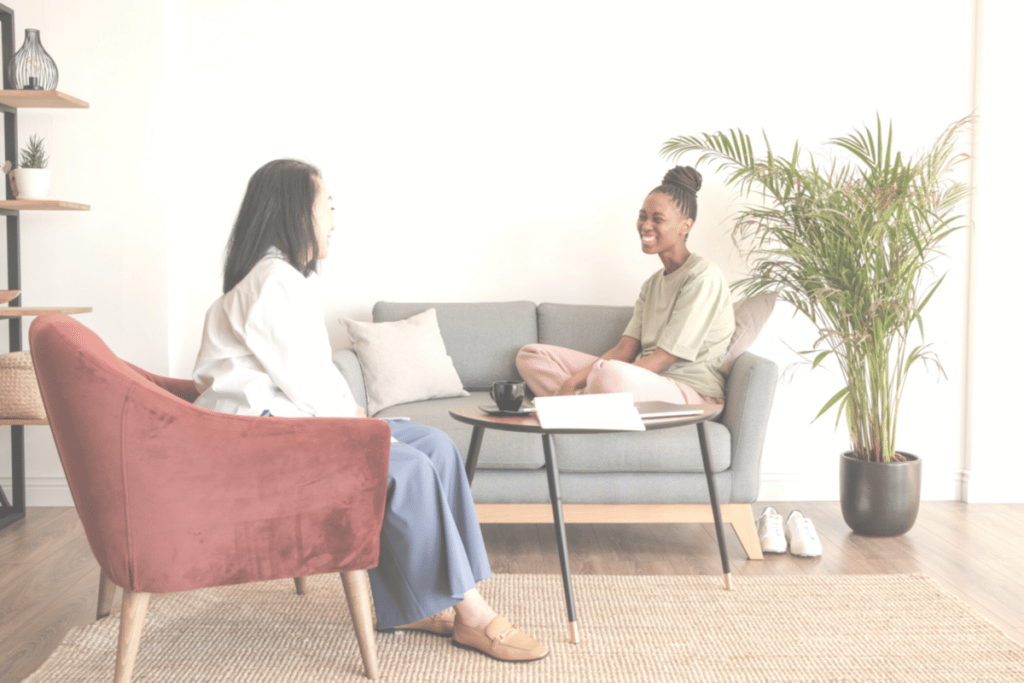 two women talking to each other happily